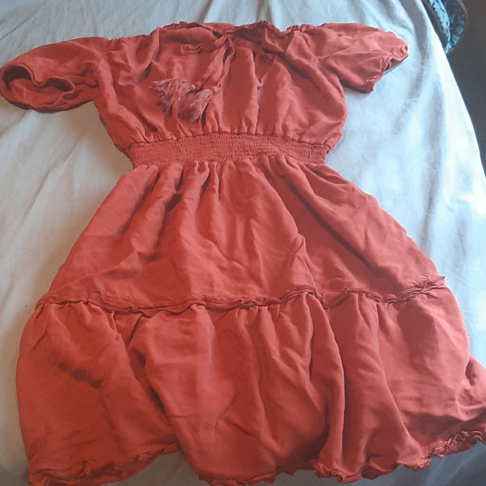 A maroon flowy dress